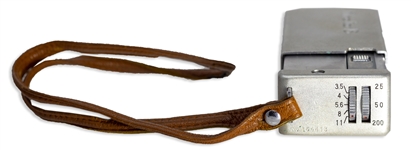 Moe Howard's Handwritten Luggage Tag & His Minolta-16 Miniature Camera, in Brown Leather Case -- Leather Tag Measures 3.75'' x 2'', Cased Camera Measures 4'' x 2'' -- Very Good